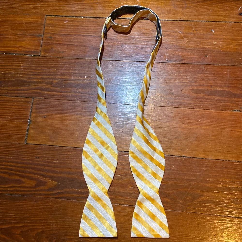 Gold and white striped bow tie